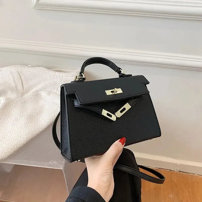 Women's Structured Top Handle Handbag with Gold Hardware and Turn Lock Closure - Image 1